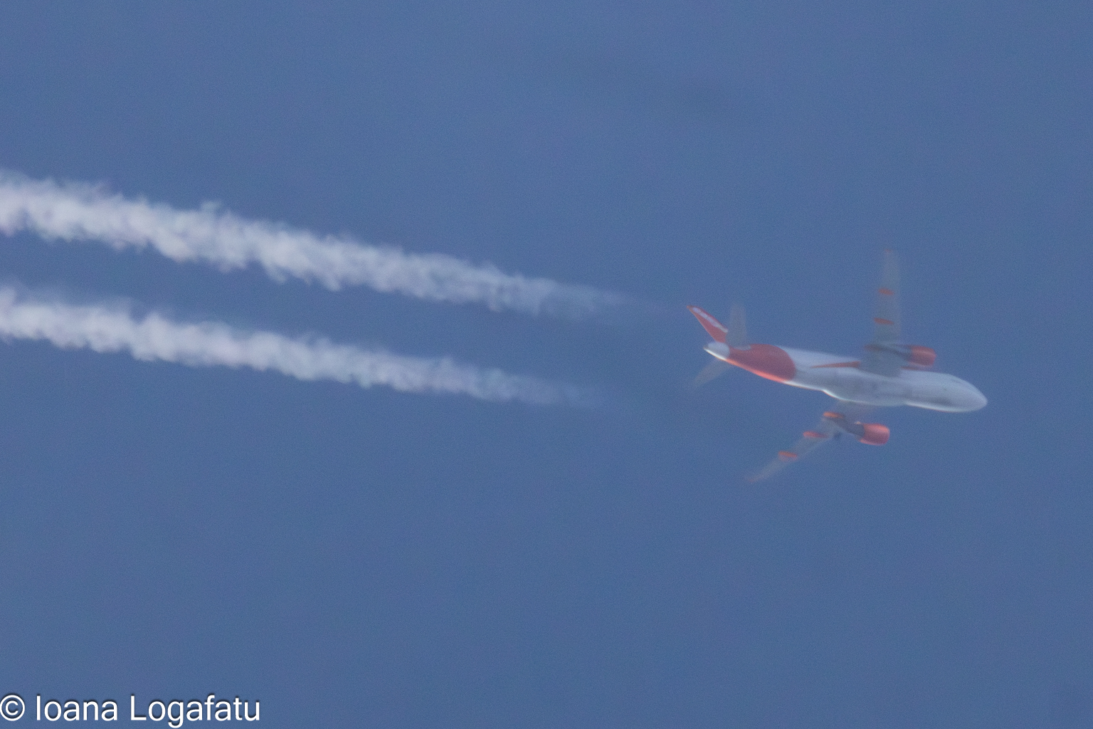 Aircraft soaring high above stunning blue skies